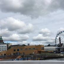 View on the boat. The brown building is a facility where you can swim on a pool or the sea and then go sauna
